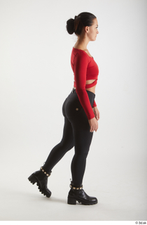  Zuzu Sweet  1 black boots black trousers casual dressed red long sleeve t shirt side view walking whole body 0002.jpg